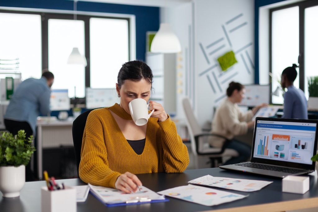 Brand manager businesswoman drinking a cup of coffee