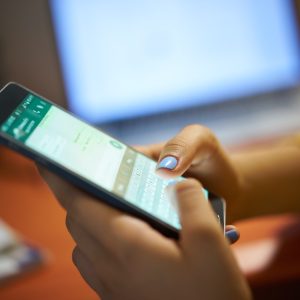 Girl Typing Phone Message On Social Network At Night